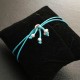 Bracelet cordon bleu turquoise boule argent 925/000 ajustable